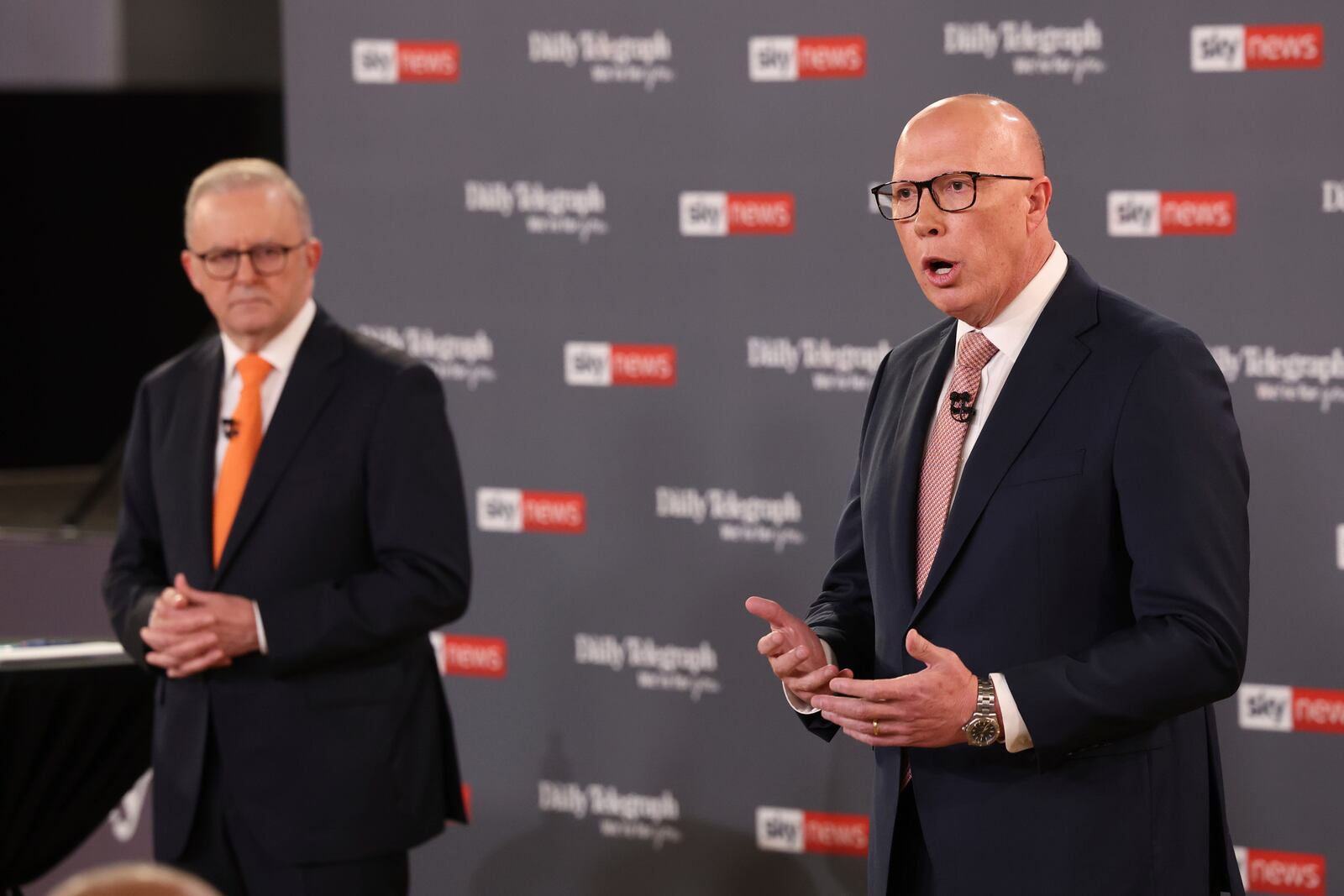 Opposition leader Peter Dutton gestures as Australian Prime Minister Anthony Albanese, left, watches during their TV debate in Sydney, Australia, Tuesday, April 8, 2025. (Jason Edwards /Pool Photo via AP)