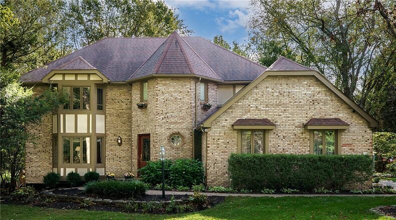This custom built Beavercreek brick home has four finished levels, including a loft bedroom with a walk in closet on the top level. CONTRIBUTED