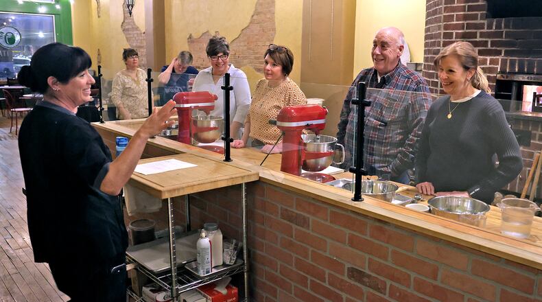 Lisa Freeman, co-owner of Le Torte Dolci Bakery, teaches a cooking class Friday, Jan. 31, 2025. BILL LACKEY/STAFF