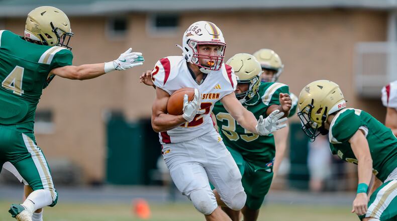 Northeastern High School senior Garrett Chadwell carries the ball during their game against Catholic Central earlier this season at Hallinean Field in Springfield. CONTRIBUTED PHOTO BY MICHAEL COOPER