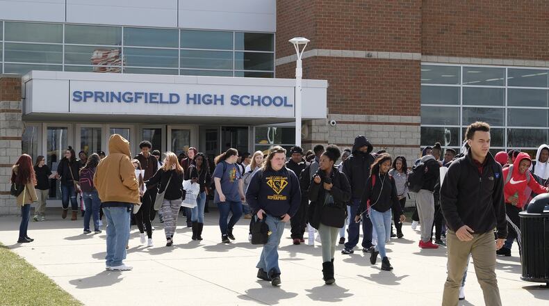 Students leave Springfield High School at the end of the school day. Bill Lackey/Staff