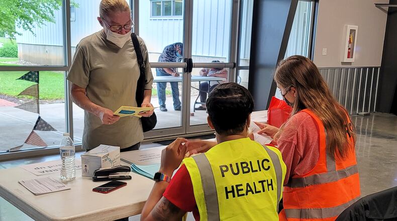 Emily King registers for her COVID-19 vaccine Wednesday, June 9, 2021 at the Butler County Fairgrounds. The Butler County Health Department with help from other agencies continues their COVID-19 vaccination clinics with Walk-in Wednesdays at the Butler County Fairgrounds in Hamilton. The clinic runs from 9 a.m. until noon on Wednesdays. NICK GRAHAM / STAFF