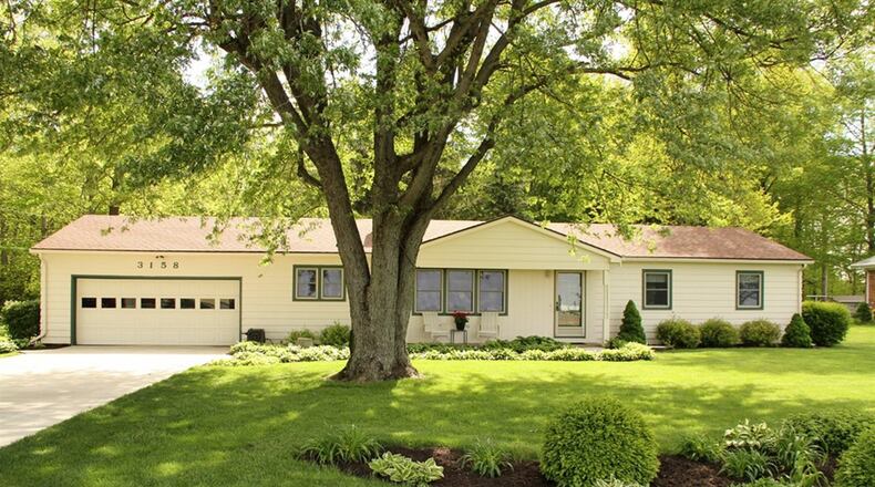 The cedar-sided ranch with 4 bedrooms sits on 6.8 acres with woods and creek. CONTRIBUTED PHOTOS BY KATHY TYLER
