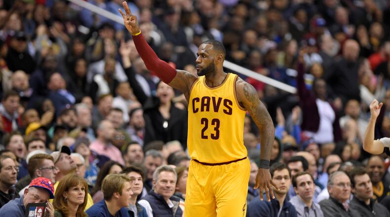Cleveland Cavaliers forward LeBron James (23) gestures after he scored a basket during the second half of an NBA basketball game against the Washington Wizards, Monday, Feb. 6, 2017, in Washington. The Cavaliers won 140-135 in overtime. (AP Photo/Nick Wass)