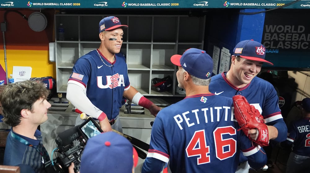 The United States team celebrates after defeating the Dominican Republic at a World Baseball Classic semifinal game, Sunday, March 15, 2026, in Miami. (AP Photo/Lynne Sladky)