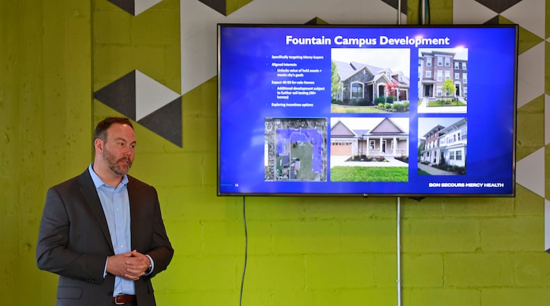 Adam Groshans, president of Mercy Health's Springfield market, talks about developing the old Mercy Hospital site during a community town hall meeting at the Springfield COhatch Thursday, Jan. 19, 2023. BILL LACKEY/STAFF