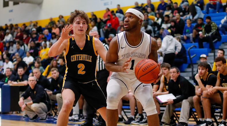 Springfield’s Larry Stephens dribbles past Centerville’s Drew Thompson during their game on Saturday night. The Elks won 52-36. CONTRIBUTED PHOTO BY MICHAEL COOPER