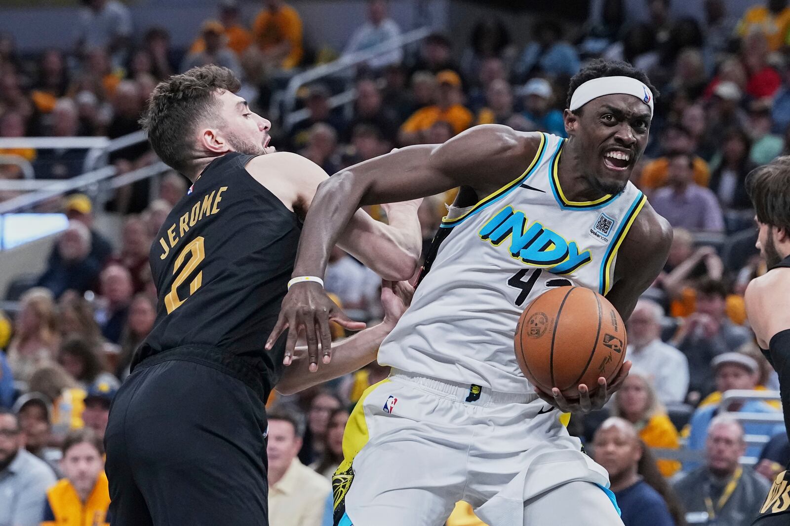 Indiana Pacers forward Pascal Siakam (43) drives to the basket against Cleveland Cavaliers guard Ty Jerome (2) in the second half of Game 4 in the Eastern Conference semifinals of the NBA basketball playoffs in Indianapolis, Sunday, May 11, 2025. (AP Photo/Michael Conroy)