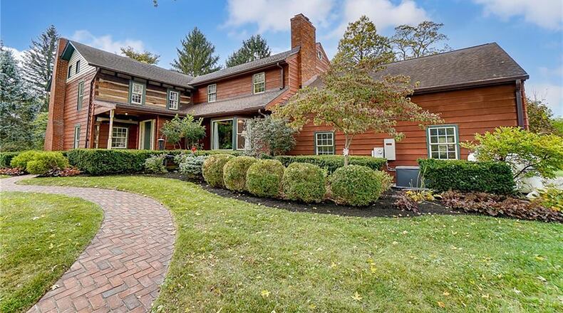 This historic log home has an 1980's addition and many updates. There are hardwood floors throughout and some exposed rough hewn logs as well as ceiling beams.