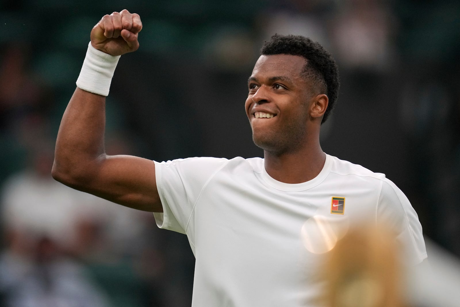Giovanni Mpetshi Perricard of France reacts during his first round men's single match against Taylor Fritz of the U.S. at the Wimbledon Tennis Championships in London, Monday, June 30, 2025. (AP Photo/Kin Cheung)
