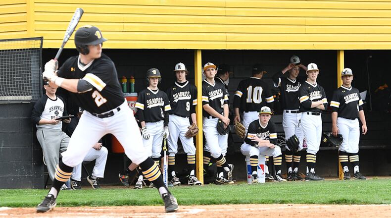 Shawnee baseball players watch a pitch with Tanner Vanvelzor at the plate during a Central Buckeye Conference game last season at Gary E. Flora Field. Contributed Photo by Bryant Billing