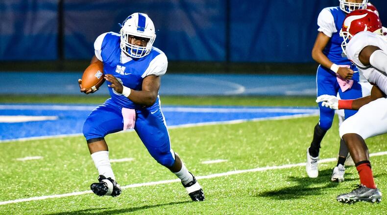 Hamilton’s Maleek Jarrett carries the ball during a game against Princeton on Oct. 20 at Virgil Schwarm Stadium in Hamilton. The visiting Vikings won 31-17. NICK GRAHAM/STAFF