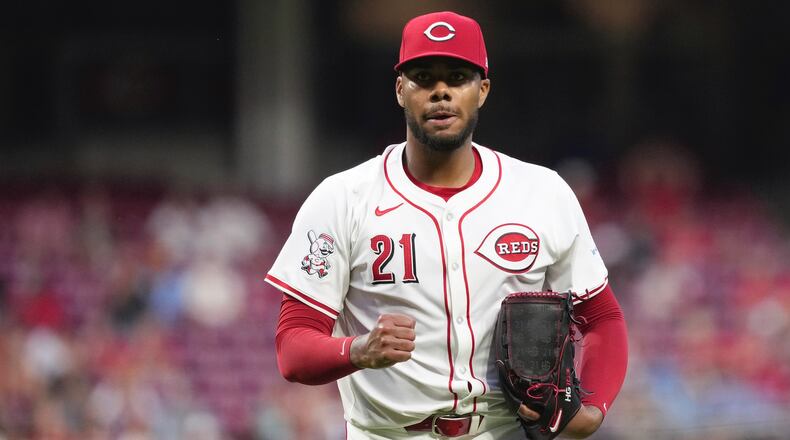 Cincinnati Reds' Hunter Greene pumps his fist after walking off the mound during the seventh inning of a baseball game against the St. Louis Cardinals, Tuesday, Aug. 13, 2024, in Cincinnati. (AP Photo/Kareem Elgazzar)