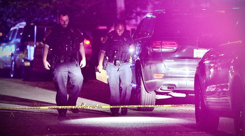Springfield Police Division officers investigate after a 20-year-old man was fatally shot Saturday night, July 8, 2023, in the 200 block of Rosewood Avenue. MARSHALL GORBY \STAFF