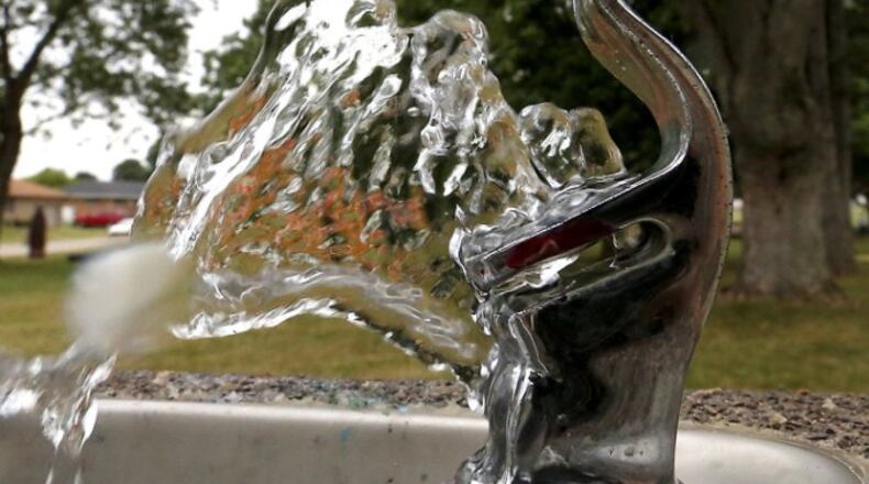 Water shoots out of the drinking fountain at Moorefield Family Park. File/Bill Lackey/Staff