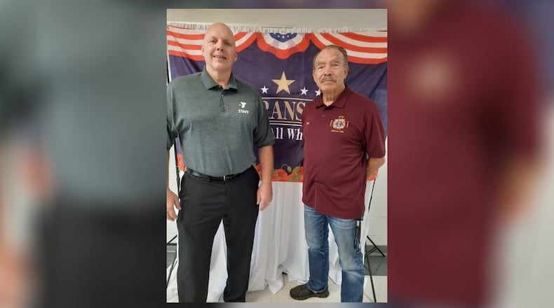 Vietnam War Veteran Fred Williams stands next to Champaign Family YMCA CEO Paul Waldsmith. From 1967 to 1971, Williams served in the USMC as a Sergeant UH-34 Helicopter Crew Chief & Gunner. Currently, Williams is the VFW Quartermaster and DAV adjutant for the Urbana Veterans of Foreign Wars/Spriggs-Wing Post 5451/DAV Chapter 31. Contributed