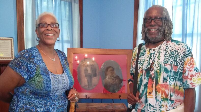 Shari and John Booth, great-grandchildren of Addison White, have loaned portraits of their great-grandparents and their great-grandmothers trunk for display at the Gammon House Museum. Photo courtesy of Malaya Booth