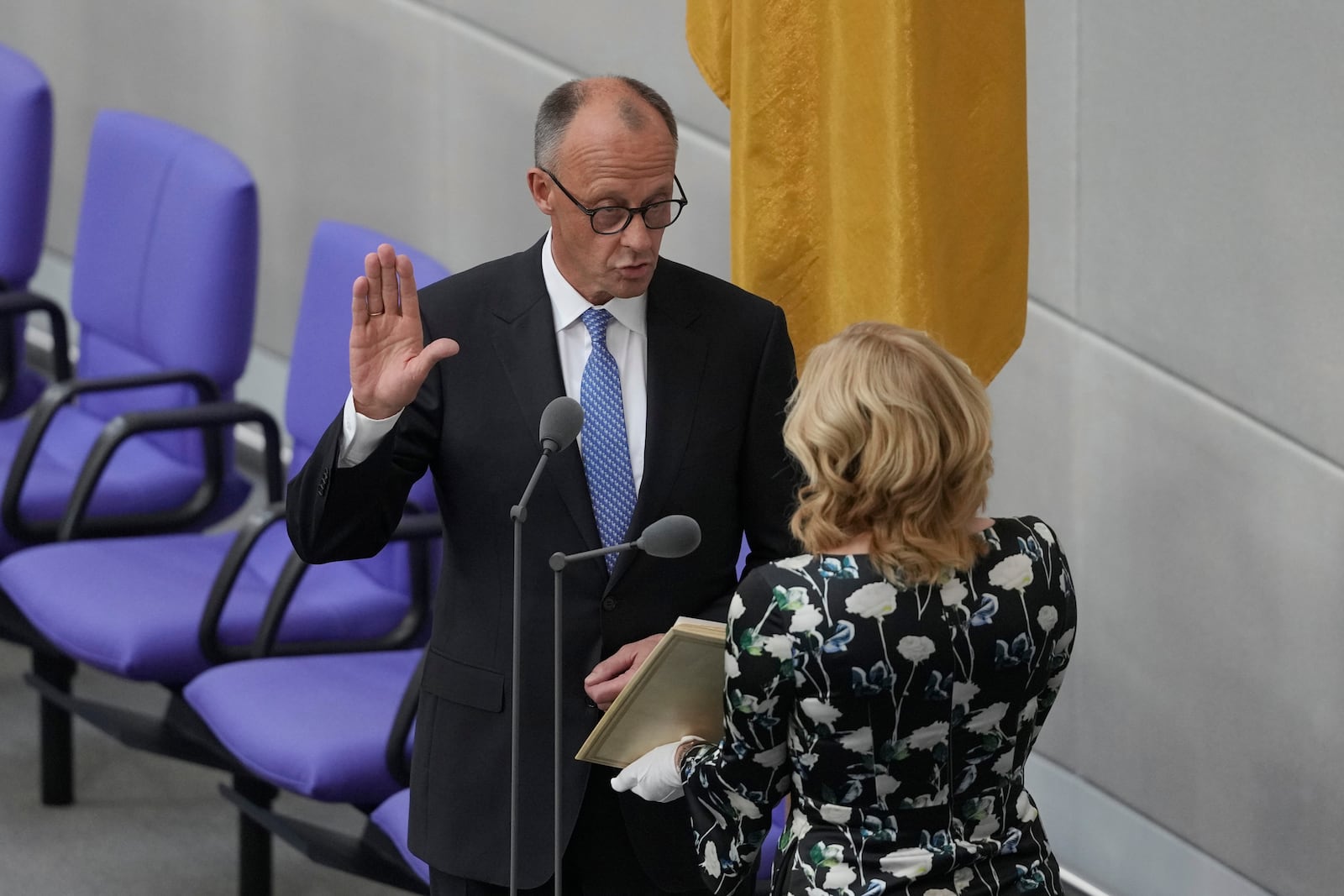 Friedrich Merz takes the oath of office in front of Parliament President Julia Kloeckner after being elected new Chancellor at the German federal parliament, Bundestag, at the Reichstag building in Berlin, Germany, Tuesday, May 6, 2025. (AP Photo/Markus Schreiber)