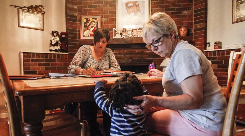 Montgomery County Children Services caseworker Janine Elders works with foster care parents and children. Montgomery County credits a program it implemented three years ago with reducing the number of foster care removals. CHRIS STEWART / STAFF