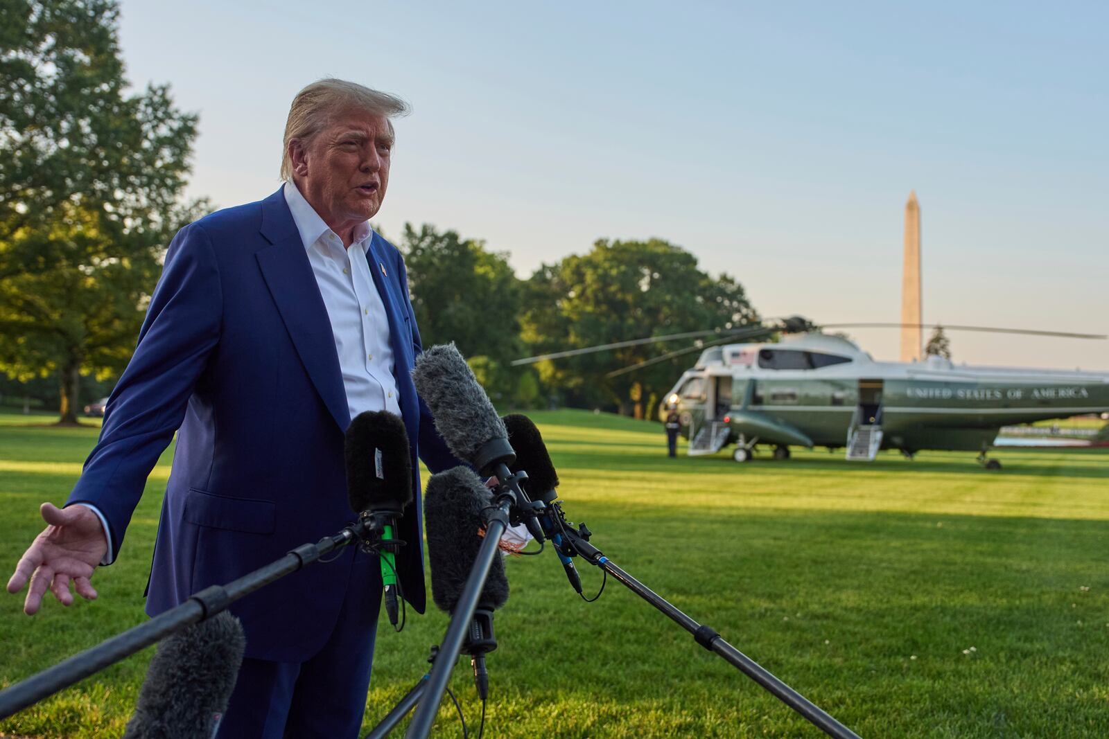 President Donald Trump speaks with reporters before boarding Marine One on the South Lawn of the White House, Tuesday, June 24, 2025, in Washington. (AP Photo/Evan Vucci)