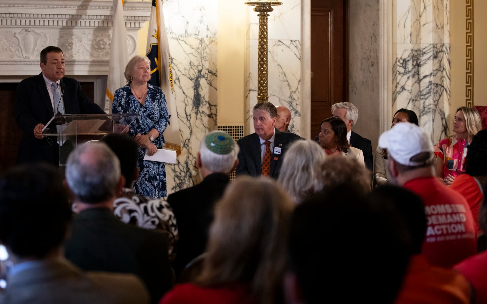 Rhode Island House Speaker K. Joseph Shekarchi, left, addresses a crowd gathered to witness Gov. Dan McKee sign a bill that bans the sale of assault-style weapons in the state of Rhode Island at the Rhode Island Statehouse in Providence, Thursday, June 26, 2025. (AP Photo/Sydney Roth)