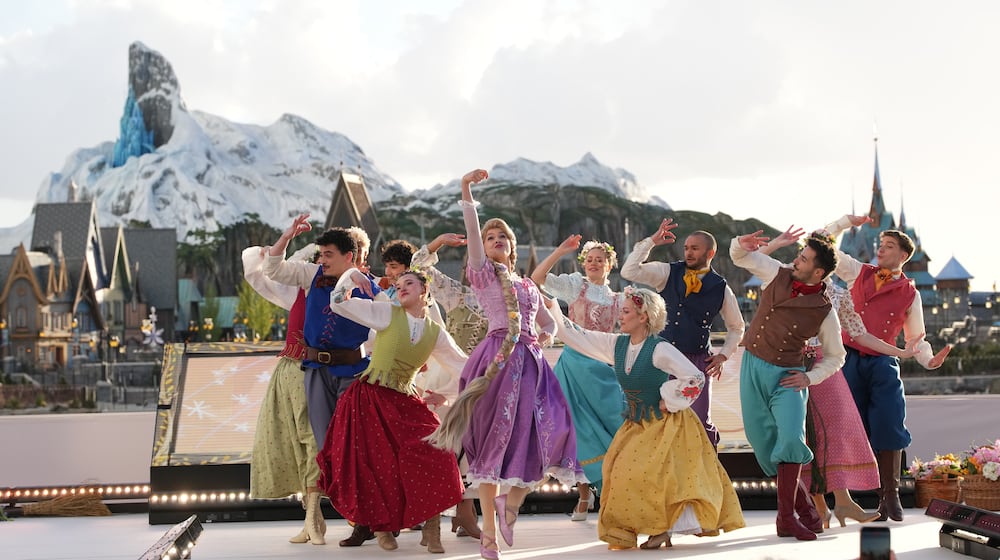 Dancers perform during the inauguration of Disney Adventure World and World Of Frozen at Disneyland Paris in Marne-la-Vallee, east of Paris, Saturday, March 28, 2026. (AP Photo/Christophe Ena)