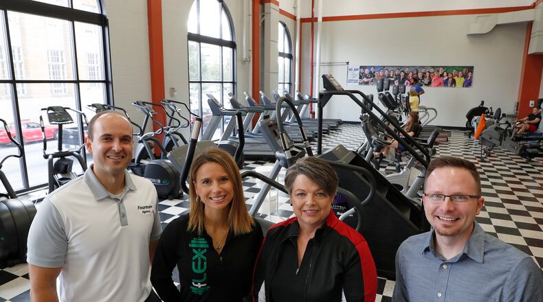 Pat Frock, second from right, is selling Springfield Health and Fitness to, from left, Jeff Fourman, Alexis Fourman and Blake Shaffer after more than 15 years. It started with 250 square feet in the Bushnell Building and grew to 4,300 square feet and more than 40 employees at the former News-Sun building. Bill Lackey/Staff