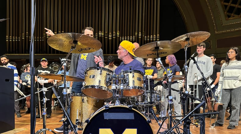 Red Hot Chili Peppers drummer Chad Smith performs with the Michigan Marching Band in Hill Auditorium on the campus of the University of Michigan Sunday, Nov. 2, 2025, in Ann Arbor, Mich. (AP Photo/Mike Householder)