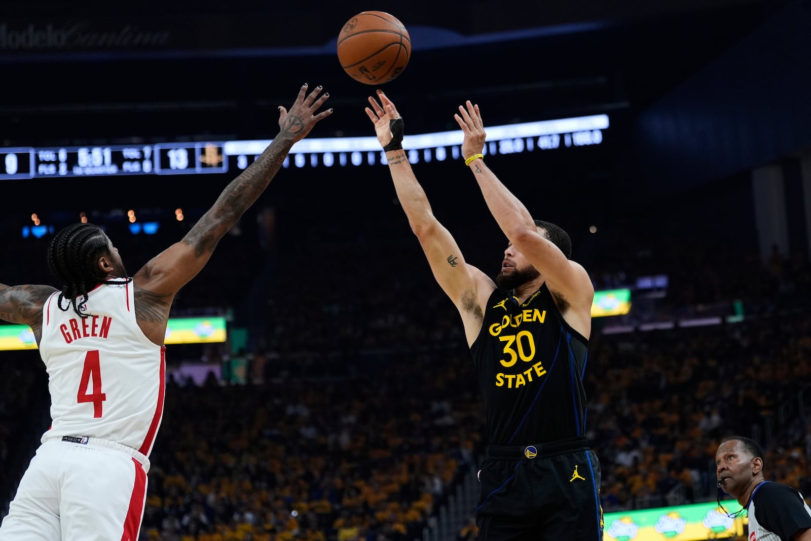 Golden State Warriors guard Stephen Curry (30) shoots a 3-point basket over Houston Rockets guard Jalen Green (4) during the first half of Game 6 of an NBA basketball first-round playoff series Friday, May 2, 2025, in San Francisco. (AP Photo/Godofredo A. Vásquez)