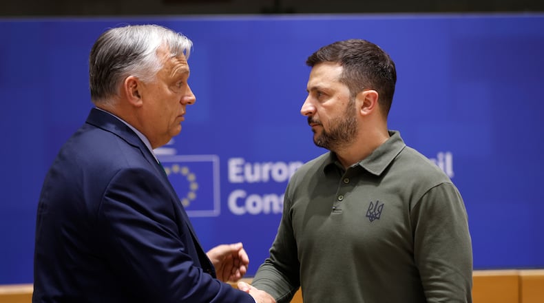 FILE -Hungary's Prime Minister Viktor Orban, left, speaks with Ukraine's President Volodymyr Zelenskyy during a round table meeting at an EU summit in Brussels, June 27, 2024. (AP Photo/Omar Havana, File)