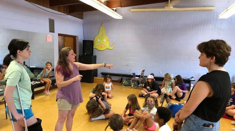 Director and choreographer Amy Davidge, center, instructs her cast during a rehearsal of the Ohio Performing Arts Institute's upcoming production of "Disney's Descendants: The Musical" to be performed this weekend. Also shown are cast members Kayleigh Seibold, left and Michaelangelo Conner, right.