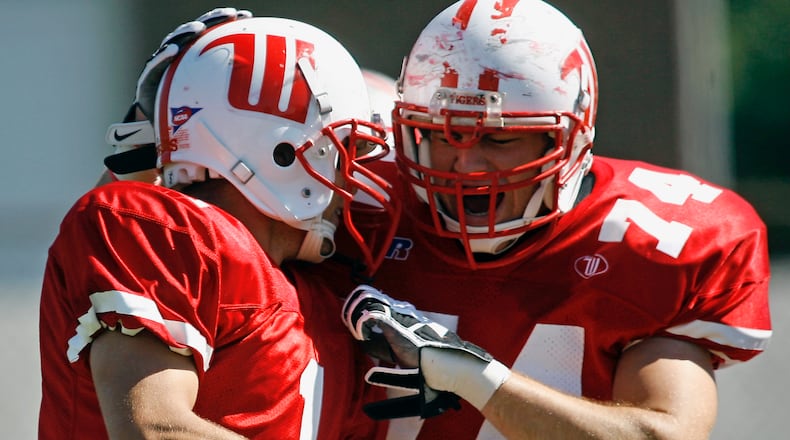 Patrick Williams (1) of Wittenberg University celebrates with BJ Coad (74) after scoring a touchdown during Saturday's game against Wooster at Edwards Maurer Field in 2007.
Staff Photo by Barbara J. Perenic