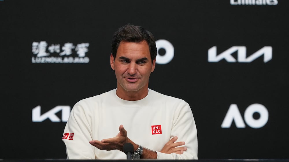 Roger Federer of Switzerland gestures during a press conference ahead of the Australian Open tennis championship in Melbourne, Australia, Thursday, Jan. 15, 2026. (AP Photo/Mark Baker)
