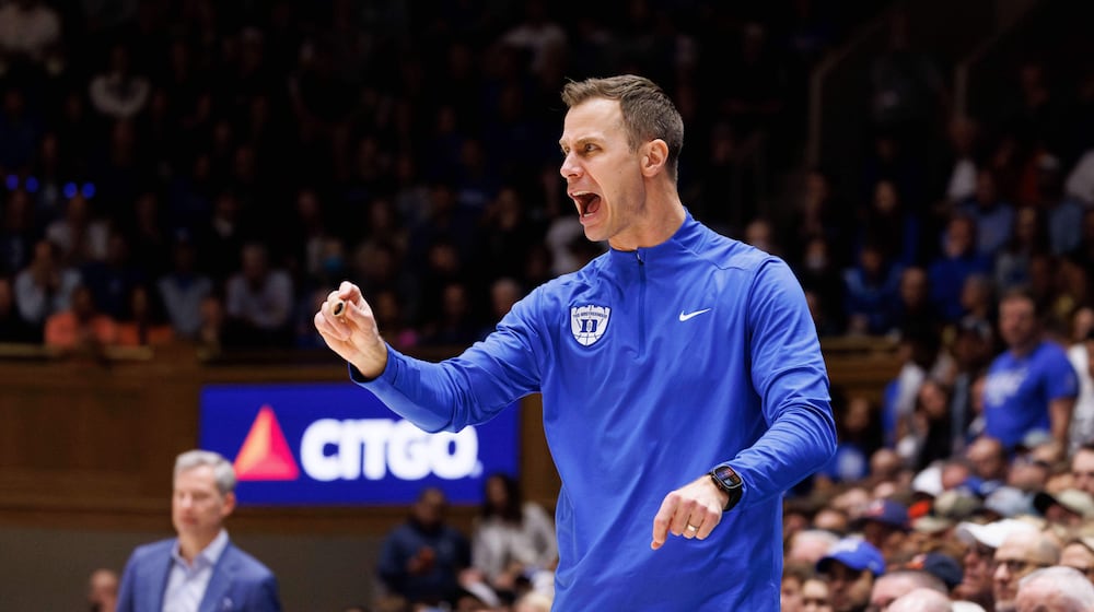 Duke head coach Jon Scheyer shouts towards the court during the second half of an NCAA college basketball game against Virginia in Durham, N.C., Saturday, Feb. 28, 2026. (AP Photo/Ben McKeown)