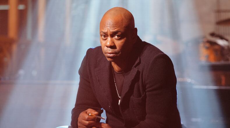 This image released by NBC shows host Dave Chappelle taping promos for his upcoming appearance on "Saturday Night Live," on Tuesday, Jan. 14, 2025, in New York. (Rosalind O'Connor/NBC via AP)