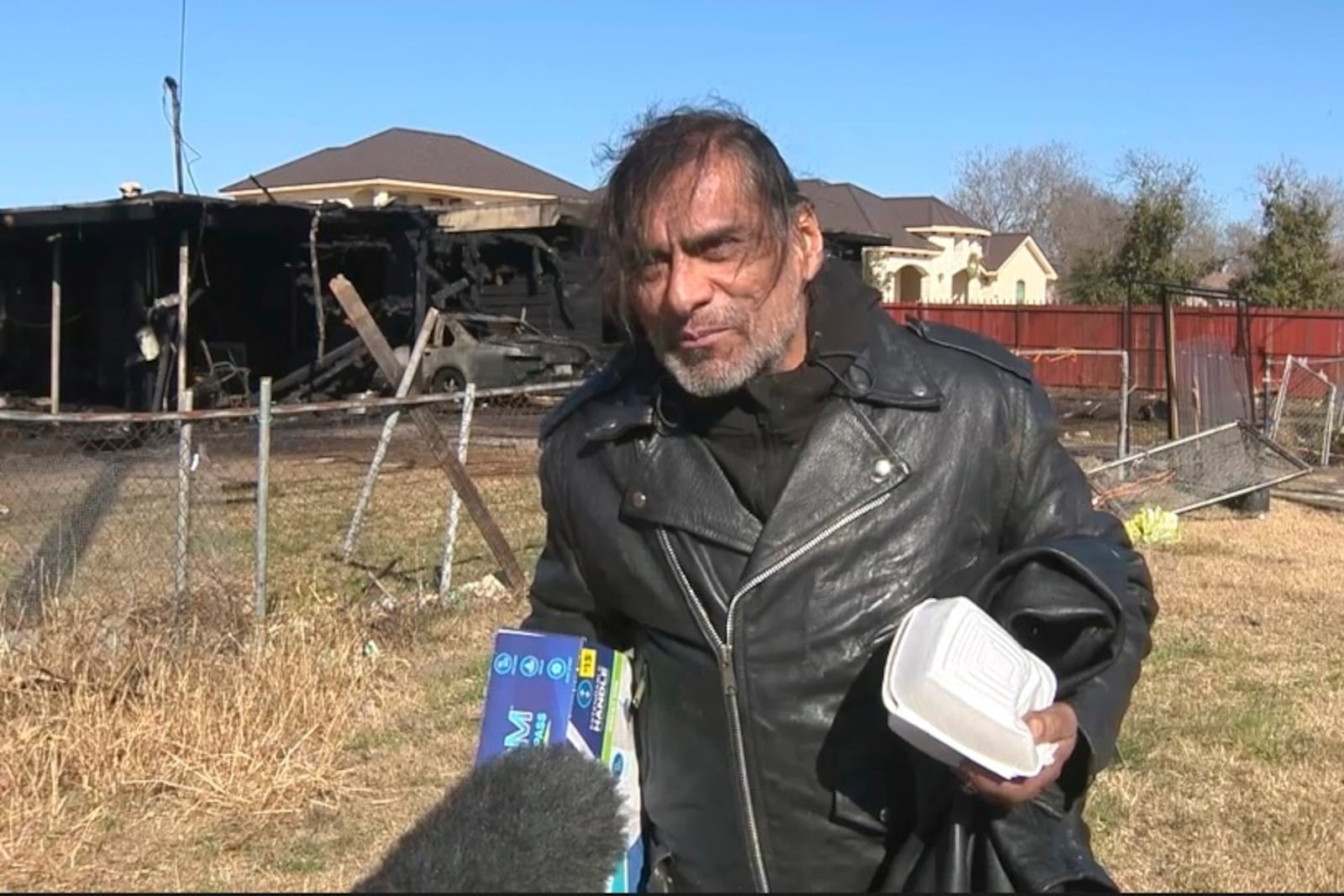 In this image taken from video, Jonathan Joss, an actor best known for his voice work on the animated television series “King of the Hill,” talks to reporters following a fire at his San Antonio, Texas, home on Thursday, Jan. 23, 2025. (KSAT via AP)
