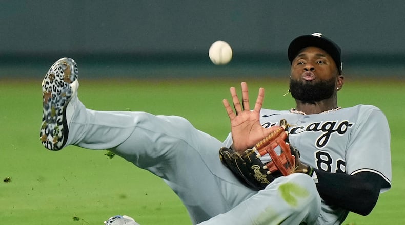 FILE -Chicago White Sox center fielder Luis Robert Jr. catches a fly ball for the out on Kansas City Royals' Mike Yastrzemski during the seventh inning of a baseball game, Aug. 15, 2025, in Kansas City, Mo. (AP Photo/Charlie Riedel), File)