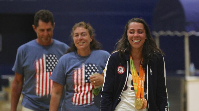 Grace Norman, right and her parents, Robin and Tim, arrive at a ceremony honoring her at Cedarville University on Wednesday, Sept. 14, 2016. David Jablonski/Staff