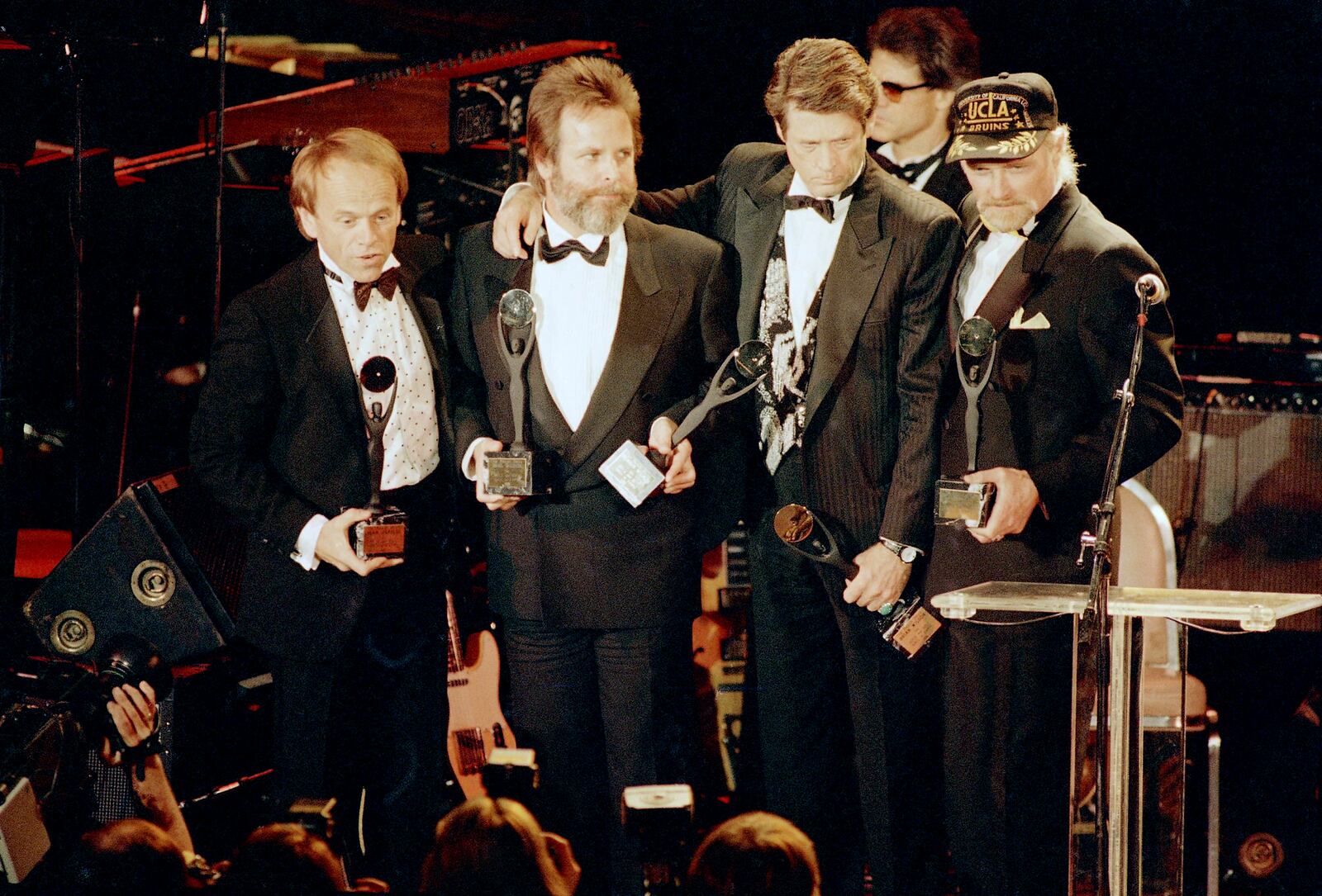 FILE - The Beach Boys, from left, Al Jardine, Carl Wilson, Brian Wilson and Mike Love, hold their trophies after being inducted into the Rock 'n' Roll Hall of Fame in New York, Jan. 21, 1988. (AP Photo/Ron Frehm, File)