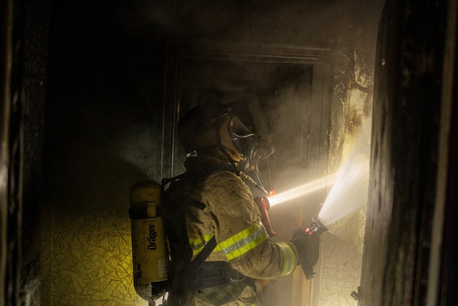 Firefighters extinguish a fire in a residential building damaged after a Russian attack in Kyiv, Ukraine, Saturday, May 24, 2025 (AP Photo/Alex Babenko)