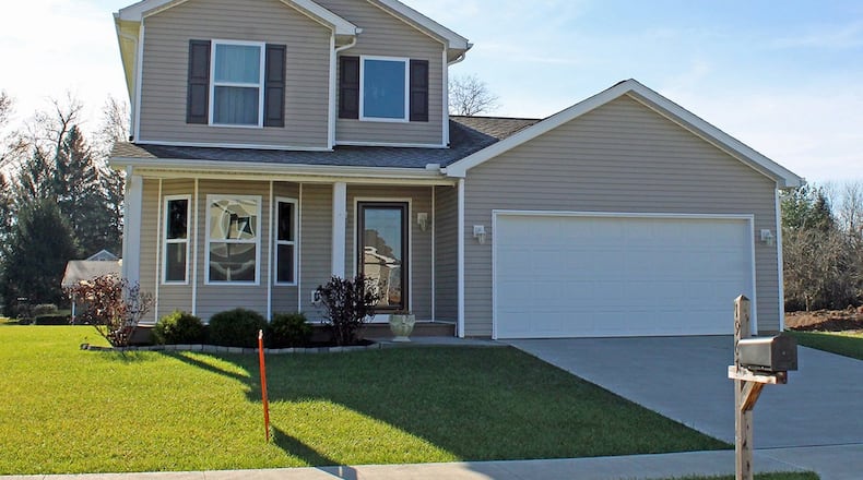 A covered front porch provides a welcoming space for this 3-bedroom home. CONTRIBUTED PHOTOS BY VICKIE KAPNAS