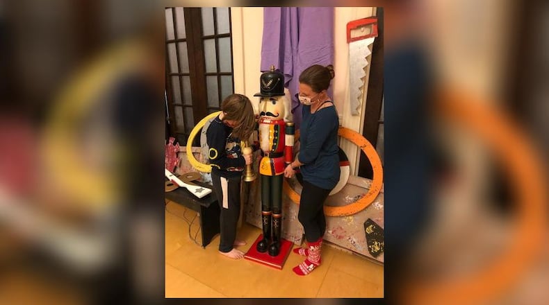 Amy Davidge and son Sean move a Nutcracker statue in preparation for rehearsals for the Ohio Performing Arts Institute's upcoming video production of "The Nutcracker," which isn't able to be performed live due to the pandemic. Photo by Brett Turner