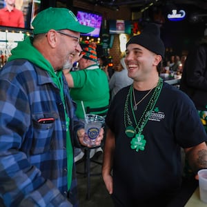Joe Hube and Gene Bowshier socialize and share laughs at the OÕConners Irish Pub on Tuesday, March 17, 2026, in Springfield. JOSEPH COOKE STAFF