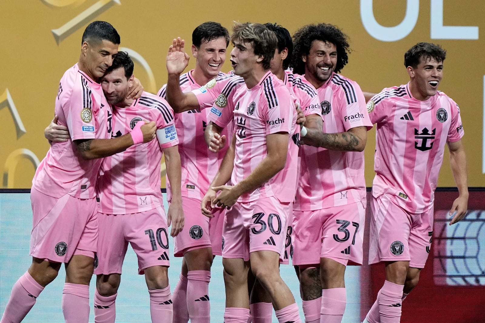 Inter Miami's Lionel Messi, second left, celebrates with Luis Suarez after scoring his side's second goal during the Club World Cup group A soccer match between Inter Miami and FC Porto in Atlanta, Thursday, June 19, 2025. (AP Photo/Brynn Anderson)
