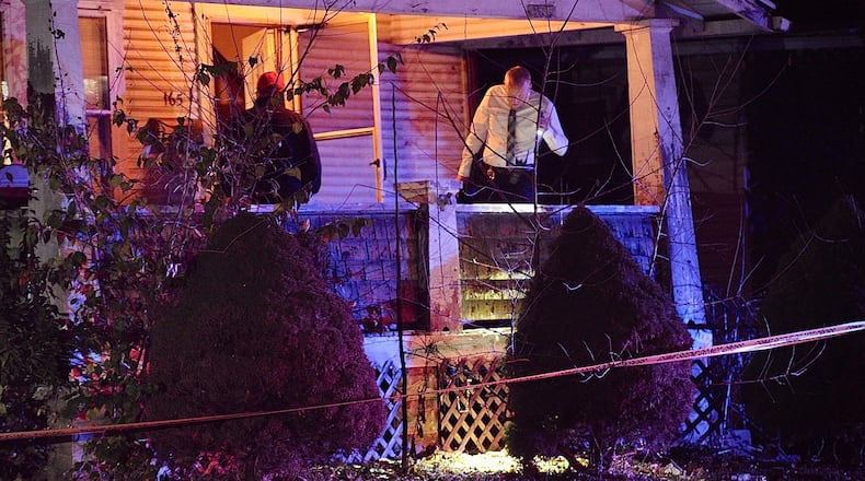 Springfield Police Division officers search at the scene of a shooting that left one man dead on Willis Avenue on Sunday, Nov. 6, 2022. MARSHALL GORBY/STAFF