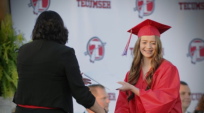 Tecumseh High School held its 2022 commencement exercises Friday, June 3, in the football stadium. In addition to the graduates, the school honored two classmates who died during their school years, giving surviving family members a cap and gown plus diploma.