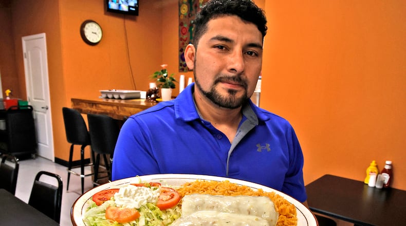 Edwin Gonzalez Cruz is serving up delicious food at his new restaurant called Los Chiapanecos Mexican Restaurant. The new restaurant, at the intersection of South Yellow Springs Street and Fair Street officially opened on Monday. BILL LACKEY/STAFF