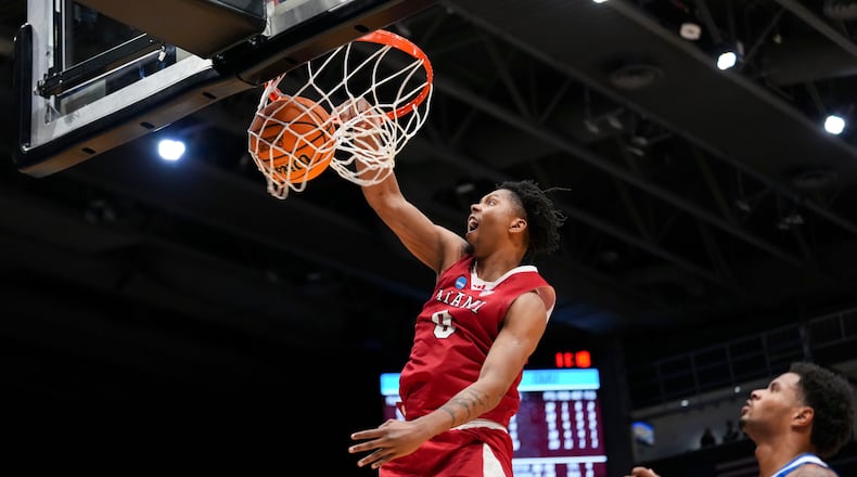 Miami (Ohio) guard Eian Elmer (0) dunks during the second half of a First Four college basketball game against SMU in the NCAA Tournament in Dayton, Ohio, Wednesday, March 18, 2026. (AP Photo/Jeff Dean)