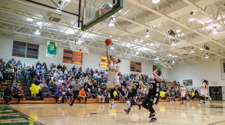 Catholic Central High School junior Abbigail Peterson shoots a layup during their game against Greenon on Saturday, Feb. 8 at Jason Collier Gymnasium. Peterson recently scored 1,000th career point becoming the first player to reach the mark since 2008. Michael Cooper/CONTRIBUTED