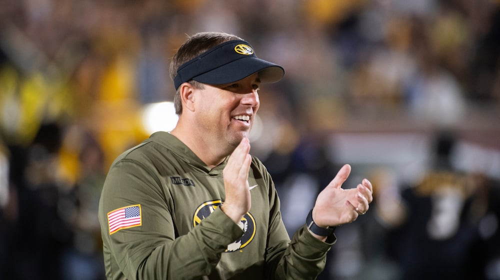 Missouri head coach Eli Drinkwitz claps during the first half of an NCAA college football game against Mississippi State, Saturday, Nov. 15, 2025, in Columbia, Mo. (AP Photo/L.G. Patterson)